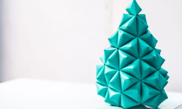 Concept of recycling and recycle idea as garbage waste shaped as Christmas tree in green.