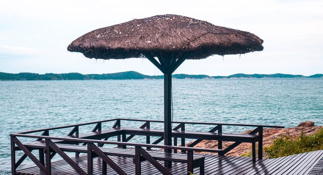Reed beach umbrella on the background of the sea and a clear sky in Khao Laem Ya-Mu Ko Samet National Park Rayong Thailand