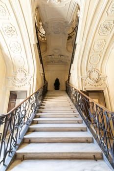 Turin, Italy - Circa August 2021: marble staircase in historic palace with luxury interior - Savoia Royal Palace
