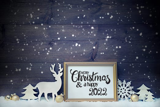 Frame With English Calligraphy Merry Christmas And A Happy 2022. Golden Decoration Like Ball, Tree And Deer. Vintage Wooden Background With Snow