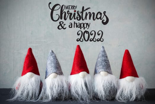 Five Santa Claus With Hat. Concrete Background With English Calligraphy Merry Christmas And A Happy 2022
