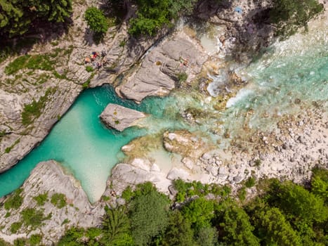 Aerial drone view of magical turquoise color of Soca river, Slovenia.