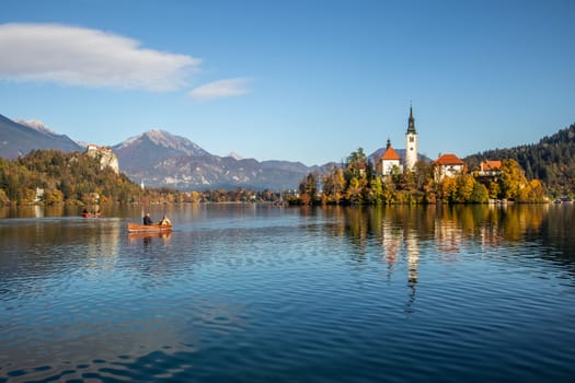 Panoramic view of Julian Alps, Lake Bled with St. Marys Church of the Assumption on the small island. Bled, Slovenia, Europe