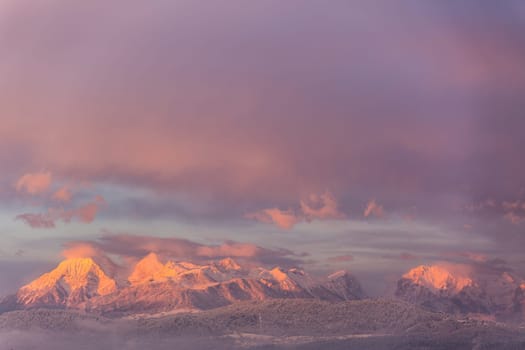 Amazing sunset winter of snow caped Kamnisko-Savinjske Alpe mountains, Slovenia, Europe.