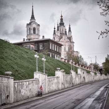 15th of May 2016, Russia, Tomsk, cityscape with temple and wood house