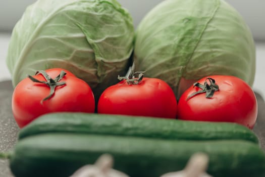 Fresh and Bright Vegetables Lie on the Kitchen Table.