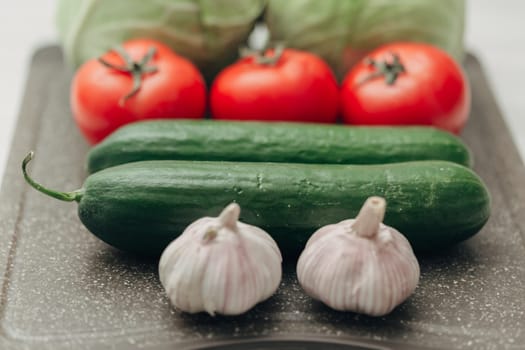 Fresh and Bright Vegetables Lie on the Kitchen Table.