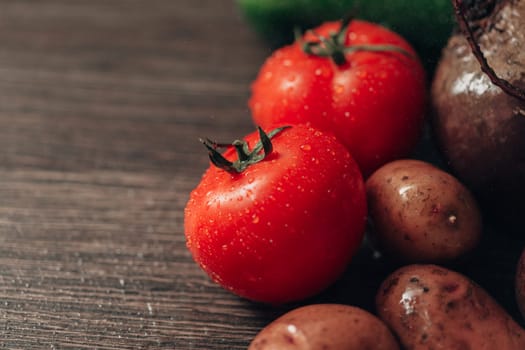 Fresh and Bright Vegetables Lie on the Kitchen Table. Copy Space