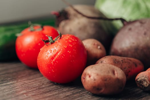 Fresh and Bright Vegetables Lie on the Kitchen Table.