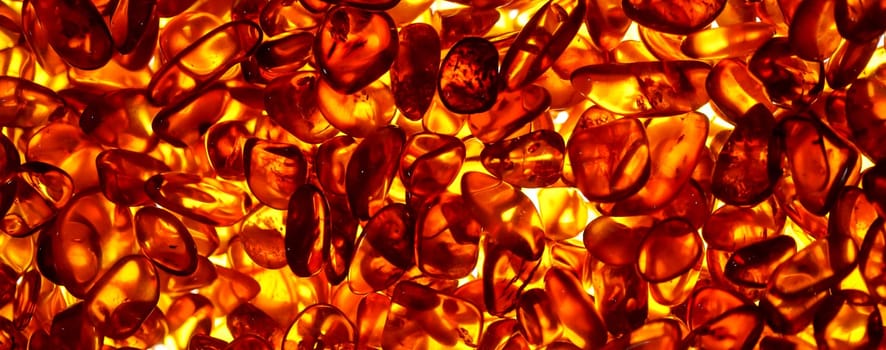 Amber in the light. Polished amber. Amber is also used extensively in jewelry.