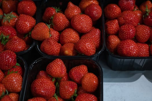 Assortment of fresh strawberry at market