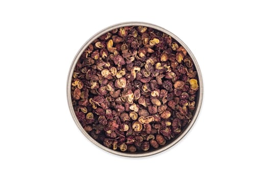 Szechuan pepper in a bowl isolated over white background