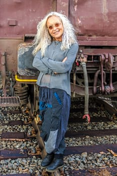 Beautiful Lady in the 50s with industry freight train in the background