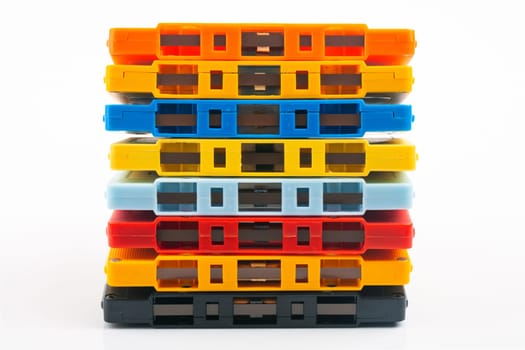 Collection of colorful audio tapes on white background