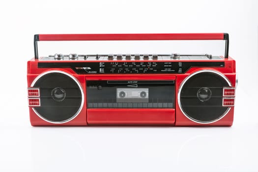 Red vintage Tape player isolated on white background