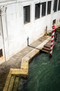 Metallic Poles By Jetty At Canal In City of venice