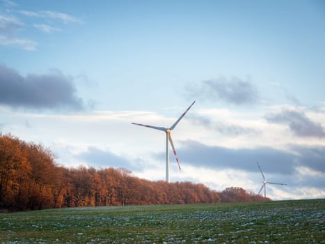 Power of wind turbine generating electricity clean energy with cloud background on the sky.Global ecology.Clean energy concept save the world. High quality photo
