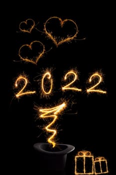 Magical new year. Magical fireworks forming number 2022. Happy new year background.