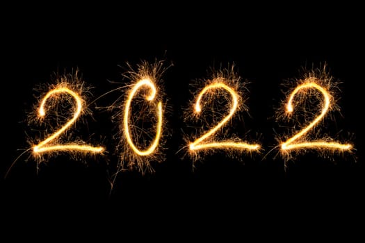 Happy new year. Digits 2022 made from fireworks isolated on black background.