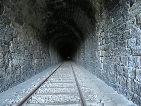 iron road bridges metal rail light at the end of the tunnel train transport