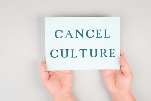 The words cancel culture are standing on a paper, thought control, censorship of free speech