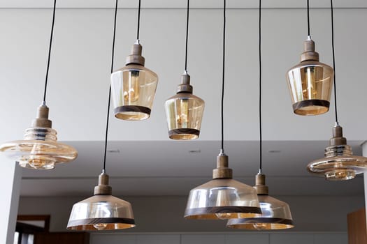 shiny glass chandeliers hanging from the ceiling