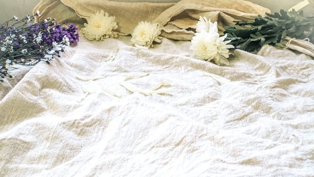 Vintage style decorate with bunch of wild flowers. Idea background. Eco design with vintage elements linen fabric. Copy space