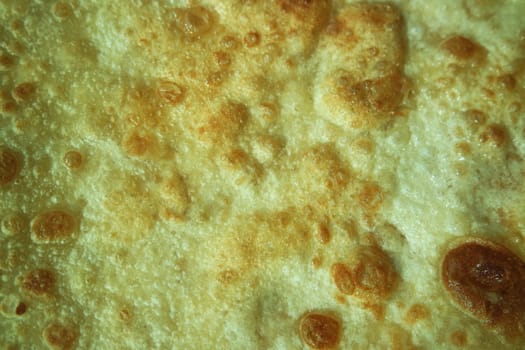 Closeup view of hand made plain bread in oil called paratha roti. Paratha is popular in India, Pakistan and other South Asian countries. Texture for bread.