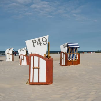 Beach chairs on the beach of Kolobrzeg on the coast of the Baltic Sea in Poland