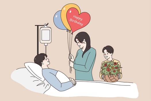 Celebrating birthday in hospital concept. Young father man lying in bed in hospital being ill greeting his wife and son with birthday balloons and flowers feeling positive vector illustration