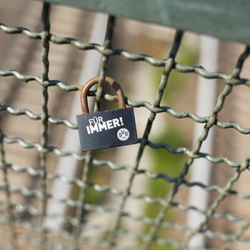 Expression of love to the soccer club Borussia Dortmund by a love lock on a bridge in Berlin