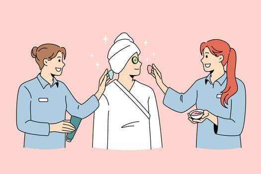 Beauty spa and cosmetology concept. Smiling women dermatologists wellness workers standing taking care of female client skin making beauty treatments vector illustration