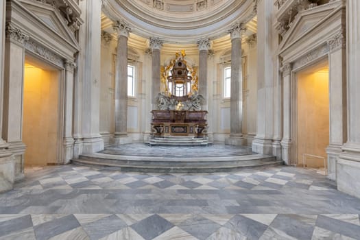 VENARIA REALE, ITALY - CIRCA MAY 2021: sacred catholic altar in Baroque style and cupola. Day light.