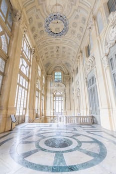 TURIN, ITALY - CIRCA JUNE 2021: The most beautiful Baroque hall of Europe located in Madama Palace (Palazzo Madama). Interior with luxury marbles, windows and corridors.