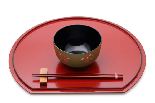 Miso soup bowl with chopsticks on tray, Traditional tableware of Japan. isolated on white background