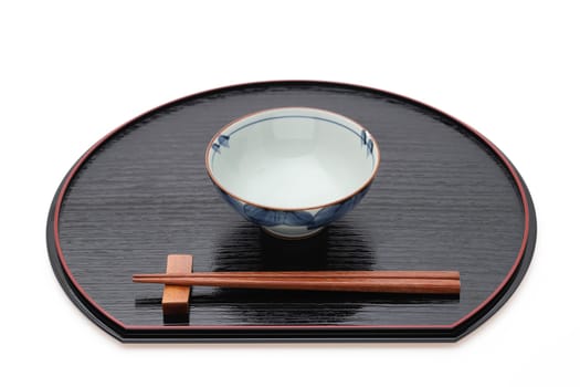 Rice bowl with chopsticks on tray, Traditional tableware of Japan. isolated on white background.