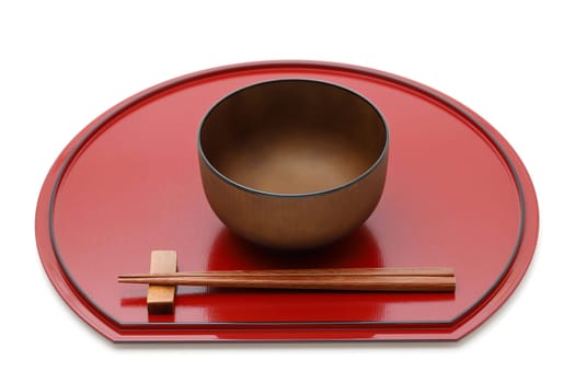 Miso soup bowl with chopsticks on tray, Traditional tableware of Japan. isolated on white background