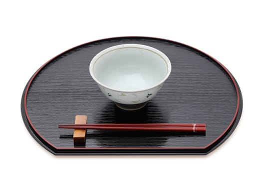 Rice bowl with chopsticks on tray, Traditional tableware of Japan. isolated on white background.