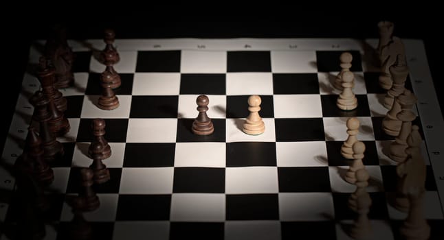 The Chess pieces on a chessboard. The concept of playing and winning a chess tournament