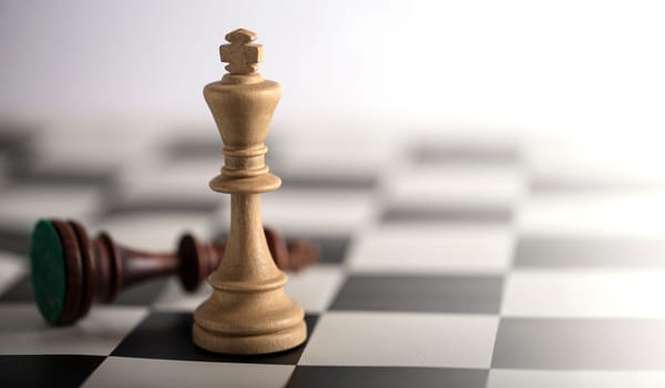 The Chess pieces on a chessboard. The concept of playing and winning a chess tournament