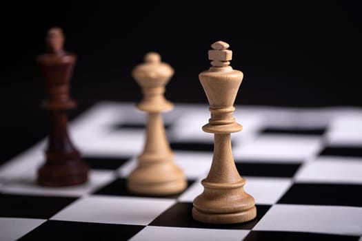 The Chess pieces on a chessboard. The concept of playing and winning a chess tournament
