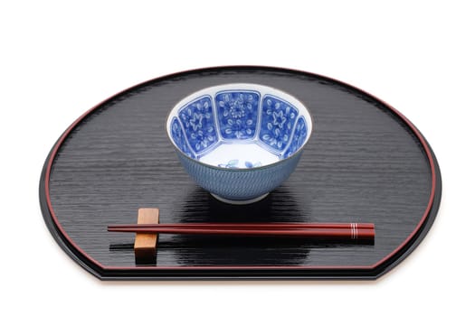 Rice bowl with chopsticks on tray, Traditional tableware of Japan. isolated on white background.
