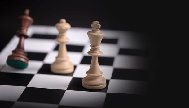 The Chess pieces on a chessboard. The concept of playing and winning a chess tournament