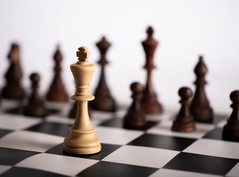 The Chess pieces on a chessboard. The concept of playing and winning a chess tournament