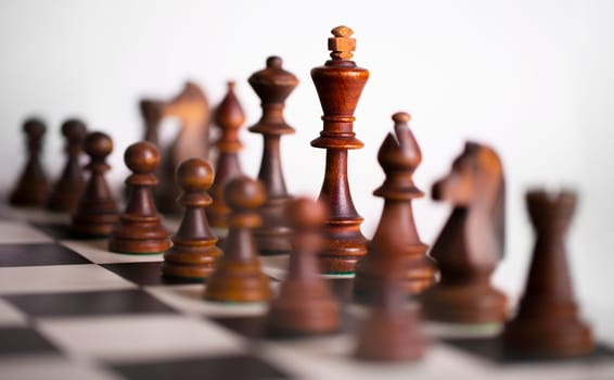 The Chess pieces on a chessboard. The concept of playing and winning a chess tournament