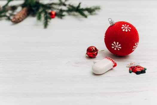 Christmas Decorations on a White Wooden Table with Copy Space Text
