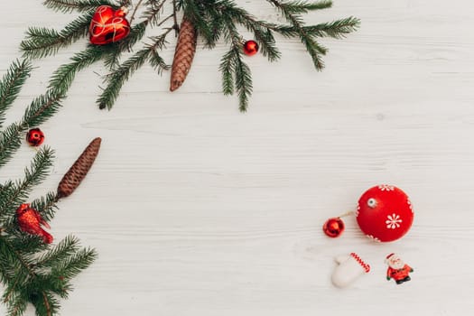Christmas Decorations on a White Wooden Table with Copy Space Text
