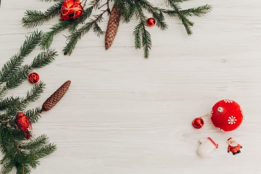 Christmas Decorations on a White Wooden Table with Copy Space Text