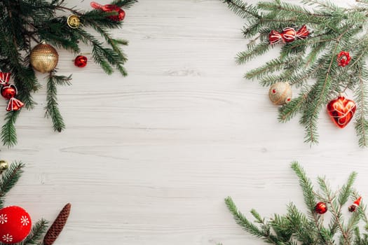 Christmas Composition on a White Wooden Table with Copy Space Text