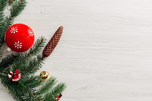 Christmas Red Decorations on a White Wooden Table with Copy Space Text